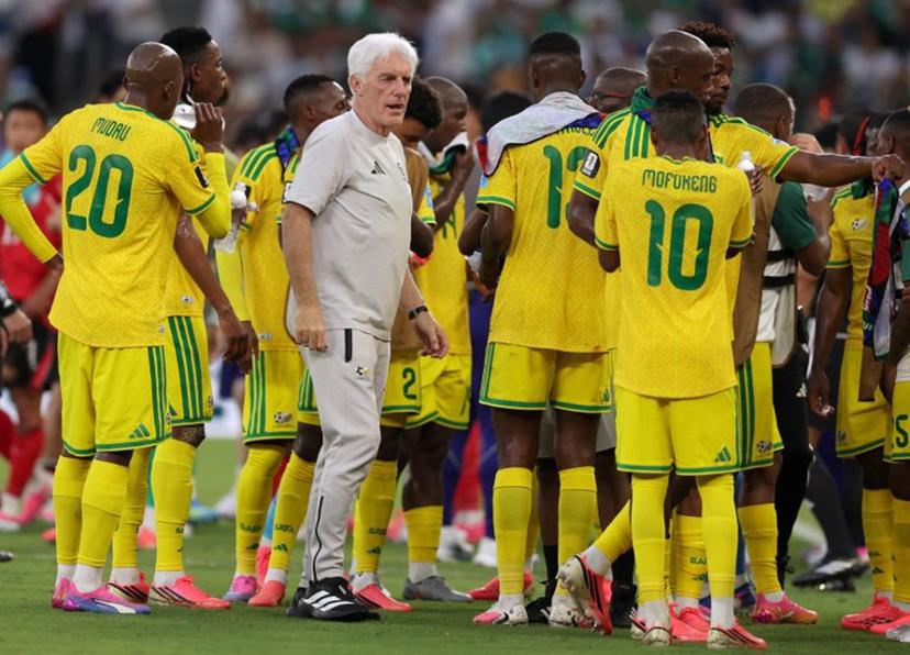 South Africa's Belgian head coach Hugo Broos talks to his players  during a hydration break of the 2026 World Cup Group A football match between South Africa and South Korea at the Monterrey Stadium in Guadalupe, Mexico, on June 24, 2026.   Julio Cesar AGUILAR / AFP
