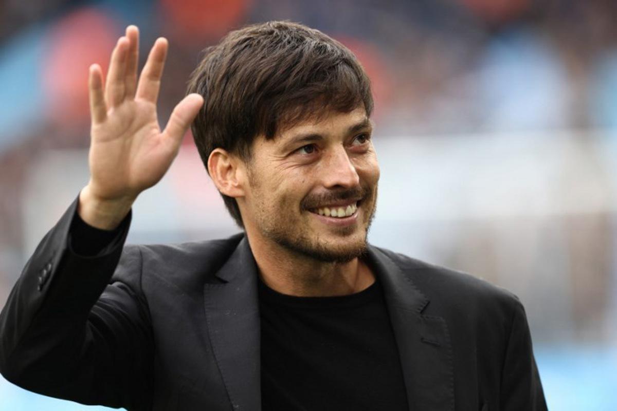 Former City player David Silva is introduced ahead of kick-off in the English Premier League football match between Manchester City and Wolverhampton Wanderers at the Etihad Stadium in Manchester, north west England, on May 4, 2024.  Darren Staples / AFP