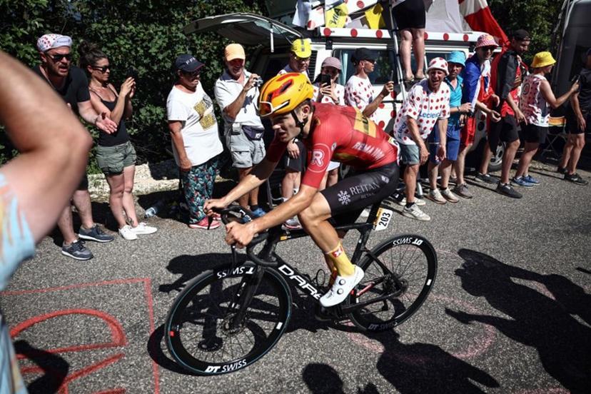 Uno-X Pro Cycling Team's Danish rider Anthony Charmig cycles in the final ascent of Col du Grand Combier in the final kilometeres of the 13th stage of the 110th edition of the Tour de France cycling race, 138 km between Chatillon-sur-Chalaronne in central-eastern France and Grand Colombier, in the Jura mountains in Eastern France, on July 14, 2023.  Anne-Christine POUJOULAT / AFP