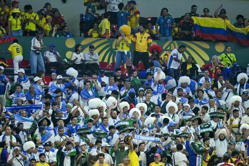 Uzbek fans cheer for their team during the 2026 World Cup Group K football match between Uzbekistan and Colombia at the Mexico City Stadium in Mexico City on June 17, 2026.   Yuri CORTEZ / AFP