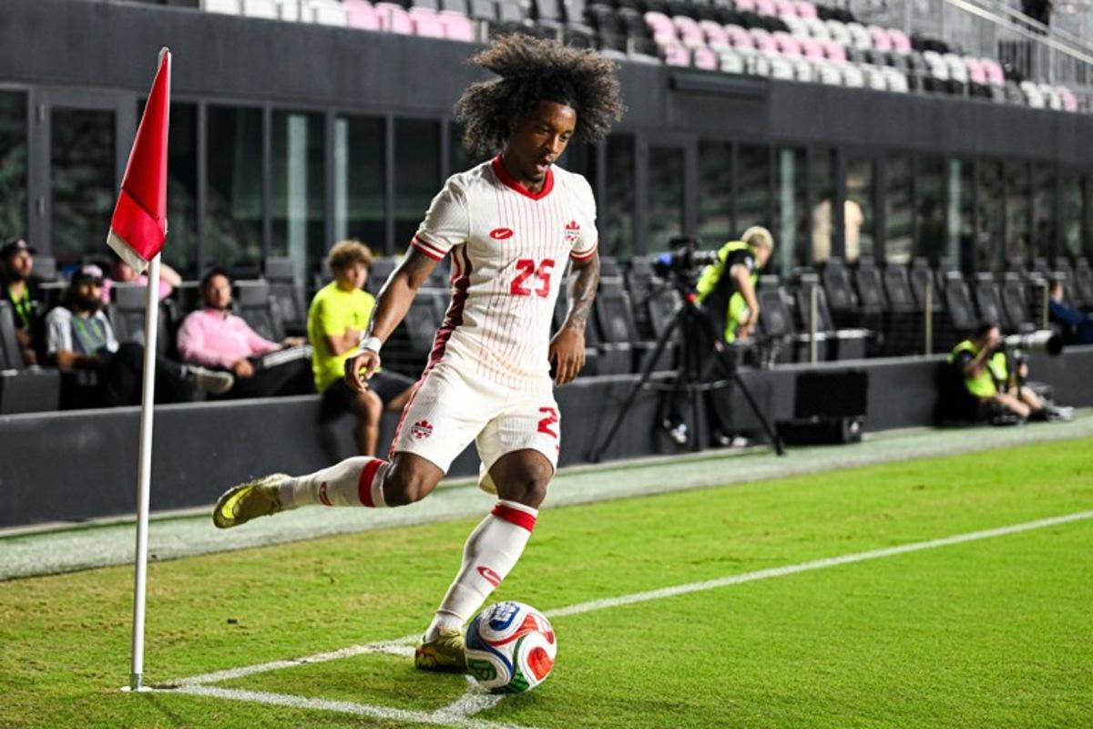 Canada's forward #25 Jayden Nelson takes a corner kick during the international friendly football match between Canada and Venezuela at Chase Stadium in Fort Lauderdale, Florida, on November 18, 2025.  CHANDAN KHANNA / AFP