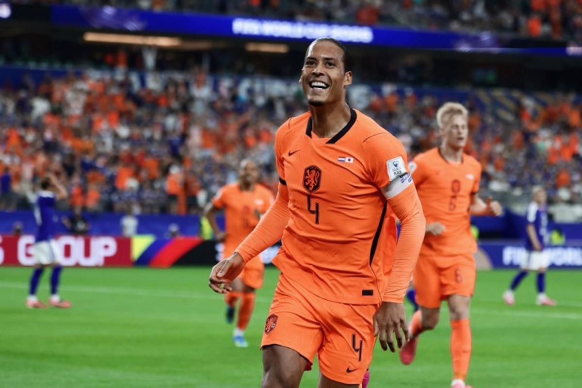 Netherlands' defender #04 Virgil van Dijk celebrates after scoring the opening goal during the 2026 World Cup Group F football match between the Netherlands and Japan at the Dallas Stadium in Arlington on June 14, 2026.    Aric Becker / AFP