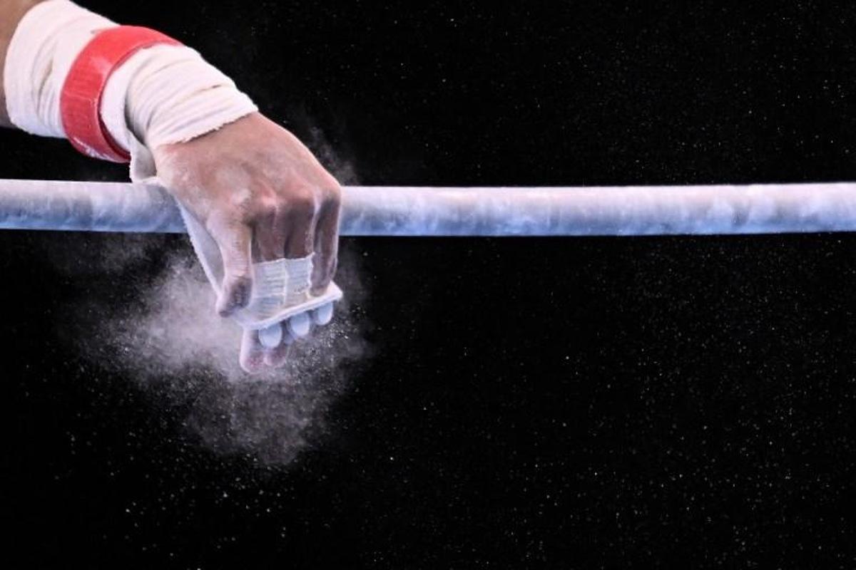 Chinese Taipei's Chih Kai Lee competes in the horizontal bar event of the artistic gymnastics men's all-around final during the Tokyo 2020 Olympic Games at the Ariake Gymnastics Centre in Tokyo on July 28, 2021.  Lionel BONAVENTURE / AFP