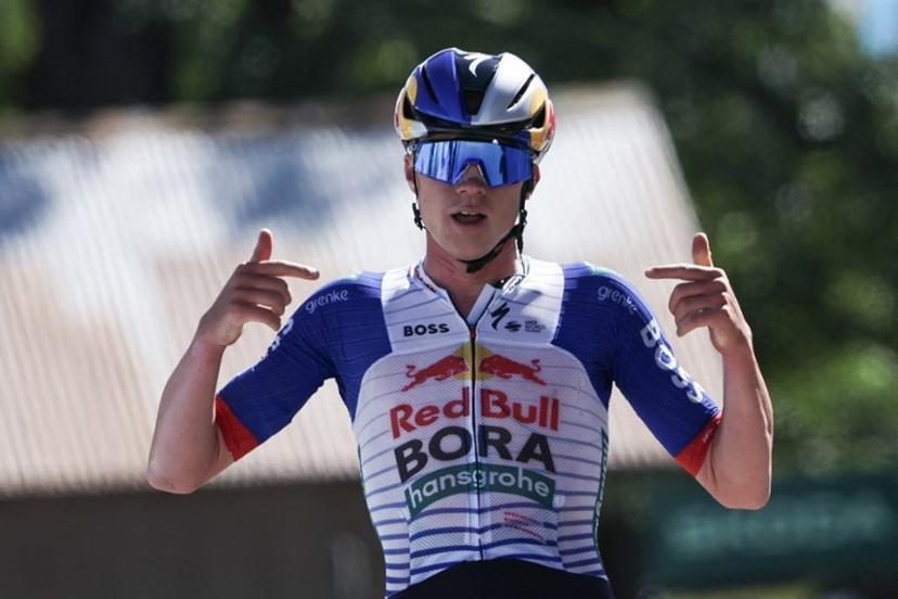 Red Bull - Bora - Hansgrohe's Belgian rider Maxim Van Gils celebrates as he cycles across the finish line to win the 6th stage of the Tour Auvergne-Rhone-Alpes cycling race (formerly known as the Criterium du Dauphine), 182,3km between Saint-Vulbas and Crest-Voland in the French Alps on June 12, 2026.  Anne-Christine POUJOULAT / AFP