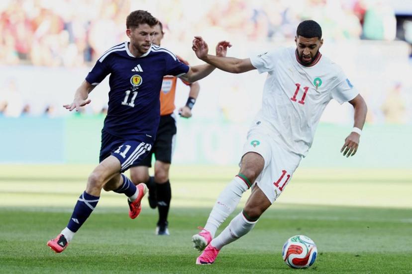 Morocco's midfielder #11 Ismael Saibari (R) and Scotland's forward #11 Ryan Christie fight for the ball during the 2026 World Cup Group C football match between Scotland and Morocco at the Boston Stadium in Foxborough on June 19, 2026.   FRANCK FIFE / AFP