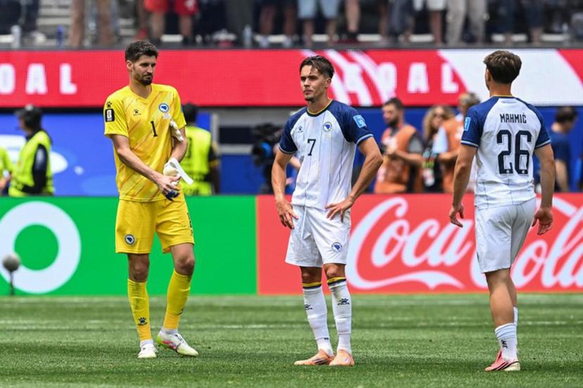 Bosnia-Herzegovina's goalkeeper #01 Nikola Vasilj, defender #07 Amar Dedic, and midfielder #26 Ermin Mahmic react after losing the 2026 World Cup Group B football match between Switzerland and Bosnia and Herzegovina at Los Angeles Stadium in Inglewood on June 18, 2026.   Patrick T. Fallon / AFP