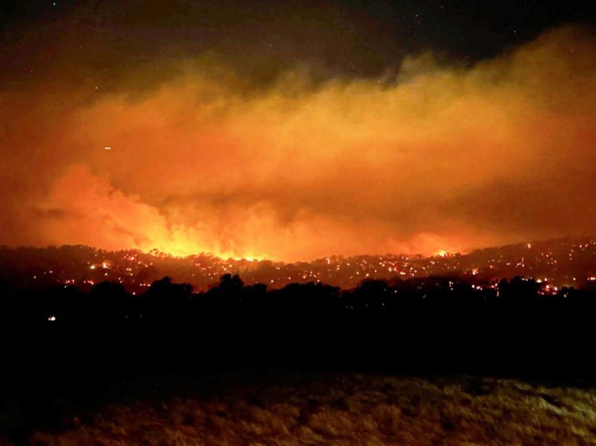 This handout photo from the CFA Wandong Fire Brigade posted on their Facebook page taken on January 7, 2026 and released on January 8 shows a bushfire burning near the town of Longwood, northern Victoria. Firefighters warned millions of Australians of "catastrophic" bushfire dangers on January 8 as they battled multiple blazes stoked by a heatwave blanketing the country. Kylie Shingles / CFA WANDONG FIRE BRIGADE / AFP