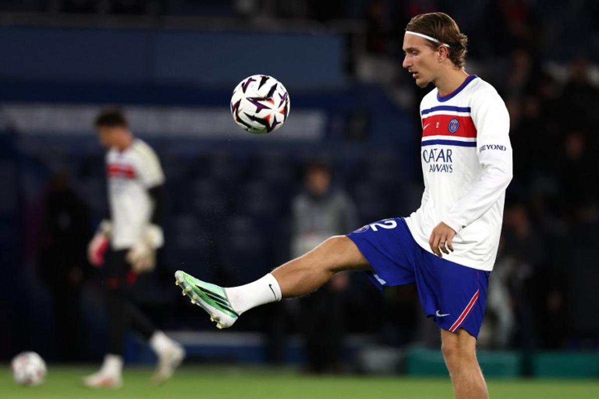 PSG's Belgian forward #22 Mika Godts controls the ball during the warm up ahead of the French L1 football match between Paris Saint-Germain (PSG) and Le Mans FC at the Parc des Princes stadium in Paris on October 10, 2026.  FRANCK FIFE / AFP