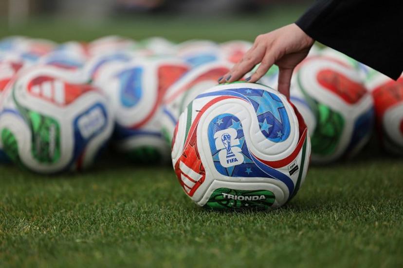 A woman holds a FIFA official World Cup 2026 ball during a training session of the Iranian national football team at their base camp in Antalya on May 19, 2026. Iran's national football team arrived in Turkey on May 19, 2026 for a training camp and to complete visa applications ahead of the 2026 World Cup, AFP correspondents said. Oner SAN / AFP