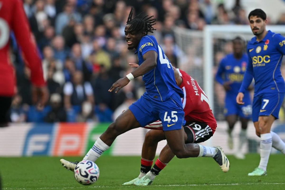 Chelsea's Belgian midfielder #45 Romeo Lavia vies with Manchester United's Cameroonian midfielder #19 Bryan Mbeumo during the English Premier League football match between Chelsea and Manchester United at Stamford Bridge in London on October 31, 2026.  Glyn KIRK / AFP