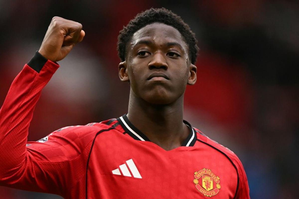 Manchester United's English midfielder #37 Kobbie Mainoo gestures to fans at the end of the English Premier League football match between Manchester United and Aston Villa at Old Trafford in Manchester, north west England, on March 15, 2026.  Oli SCARFF / AFP