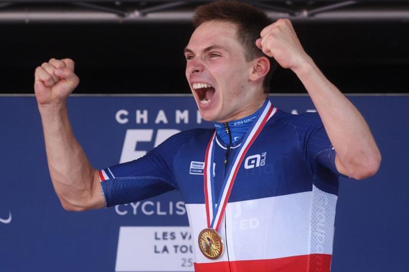 Groupama-FDJ United's French rider Romain Gregoire celebrates on the podium after winning the men's Elite Road Race, part of the French Cycling Championship 2026, near La Tour du Pin, central-eastern France on June 28, 2026.  Alex MARTIN / AFP