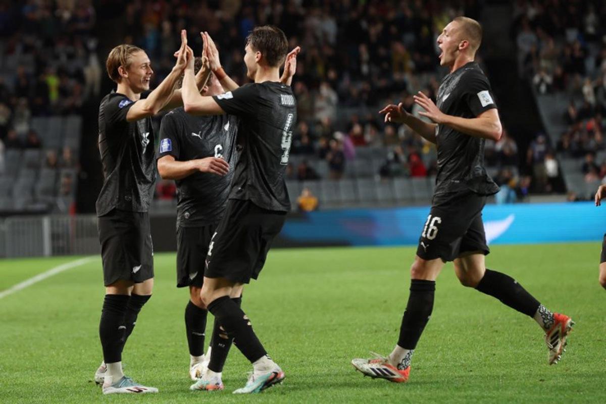 New Zealand's Ben Waine celebrates his goal with teammates during the international friendly football match between New Zealand and Chile at Eden Park in Auckland on March 30, 2026.  Michael Bradley / AFP