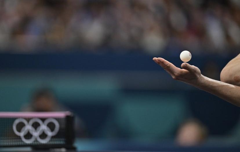 Germany's Dimitrij Ovtcharov serves during his men's table tennis singles match in the team quarter-finals between Sweden and Germany at the Paris 2024 Olympic Games at the South Paris Arena in Paris on August 6, 2024.  WANG Zhao / AFP