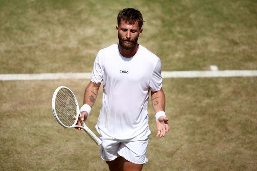 France's Corentin Moutet reacts after losing a point against Spain's Alejandro Davidovich Fokina during their men's singles round of 16 tennis match on day three of the ATP HSBC Championships at Queen's Club in west London on June 18, 2026. Fokina won the match 6-4, 6-3. Henry NICHOLLS / AFP