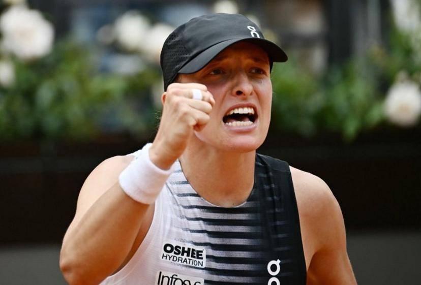 Poland's Iga Swiatek celebrates after winning against USA's Jessica Pegula during the ATP Rome Open tennis tournament at Foro Italico in Rome on May 13, 2026.   Filippo MONTEFORTE / AFP