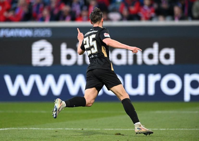 Elversberg's German midfielder #25 Lukas Petkov celebrates scoring the opening goal during the German Bundesliga relegation first-leg football match  between FC Heidenheim and SV Elversberg in Heidenheim on May 22, 2025.  THOMAS KIENZLE / AFP