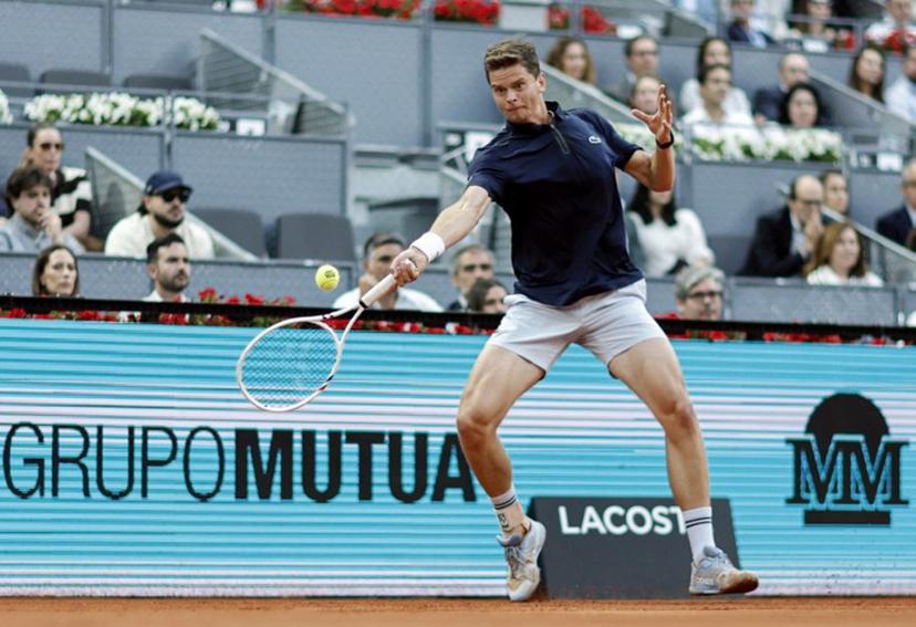 Belgium's Alexander Blockx returns the ball to Germany's Alexander Zverev during their 2026 ATP Tour Madrid Open tennis tournament semi-final singles match at the Caja Magica in Madrid, on May 1, 2026.  OSCAR DEL POZO / AFP