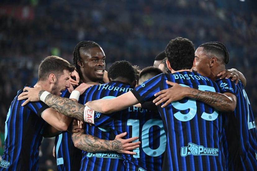 Inter players celebrate after opening the scoring during the Italian Cup (Coppa Italia) final football match between Lazio Rome and Inter Milan at the Olympic stadium in Rome on May 13, 2026.  Isabella BONOTTO / AFP