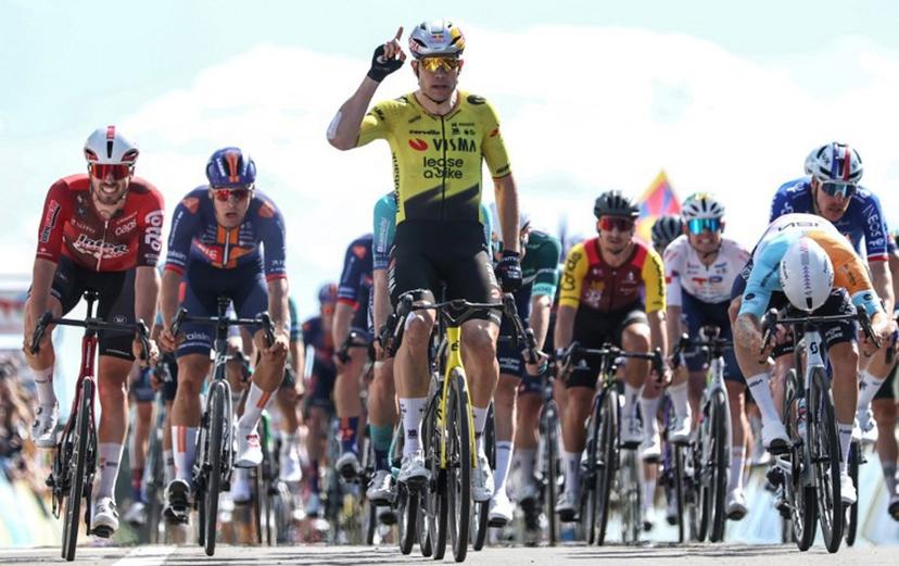 Team Visma | Lease a Bike's Belgian rider Wout Van Aert celebrates crossing the finish line to win the 5th stage of the Tour Auvergne-Rhone-Alpes cycling race (formerly known as the Criterium du Dauphine), 195,8km between Saint-Chamond and Villars-les-Dombes, central France, on June 11, 2026.  Anne-Christine POUJOULAT / AFP