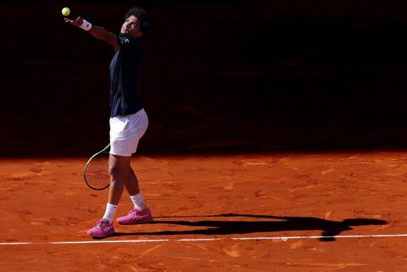 France's Arthur Fils serves a ball to Italy's Jannik Sinner during their 2026 ATP Tour Madrid Open tennis tournament semi-final singles match at the Caja Magica in Madrid, on May 1, 2026.  Thomas COEX / AFP