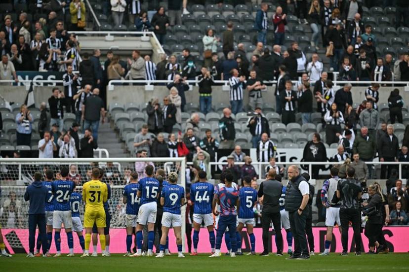 Ipswich players applaud their fans in the top tiers of St James' Park after the English Premier League football match between Newcastle United and Ipswich Town, in Newcastle-upon-Tyne, north east England on April 26, 2025. Newcastle won the match 3-0. Paul ELLIS / AFP