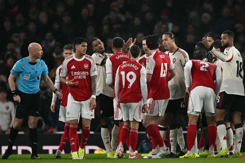 Players argue led by Liverpool's Dutch defender #04 Virgil van Dijk (CR) and Arsenal's English midfielder #41 Declan Rice (C) after Liverpool's Dutch defender #30 Jeremie Frimpong turned his ankle and went down during the English Premier League football match between Arsenal and Liverpool at the Emirates Stadium in London on January 8, 2026.   Ben STANSALL / AFP