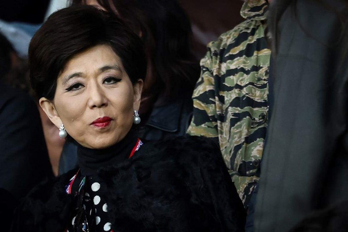 US businesswoman and President of Olympique Lyonnais Michele Kang reacts during the French L1 football match between Paris Saint-Germain (PSG) and Olympique Lyonnais (OL) at the Parc des Princes stadium in Paris on April 19, 2026.  FRANCK FIFE / AFP