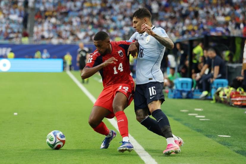 Cape Verde's midfielder #14 Deroy Duarte and Uruguay's defender #16 Mathias Olivera fight for the ball during the 2026 World Cup Group H football match between Uruguay and Cape Verde at the Miami Stadium in Miami Gardens on June 21, 2026.   PATRICIA DE MELO MOREIRA / AFP