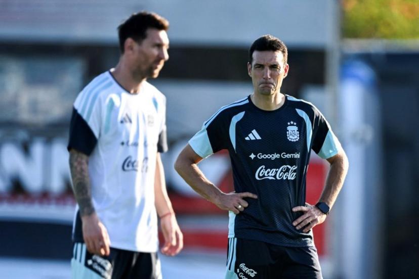 Argentina's head coach Lionel Scaloni (R) looks at forward Lionel Messi during a training session in Ezeiza, Buenos Aires province, Argentina, on March 30, 2026, ahead of a friendly match against Zambia on March 31 at the La Bombonera Stadium in Buenos Aires.  Luis ROBAYO / AFP