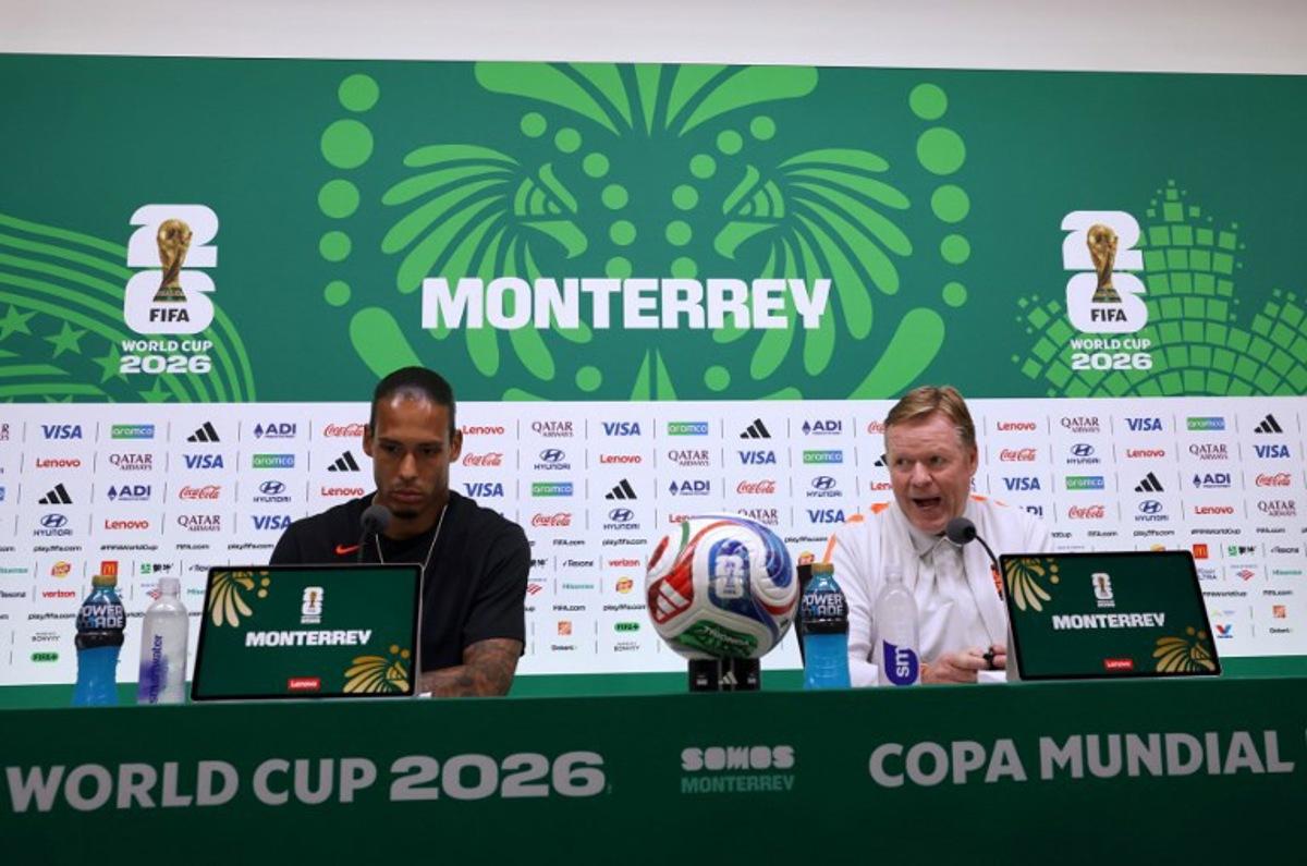 Netherlands' defender #04 Virgil van Dijk (L) listens as head coach Ronald Koeman speaks during a press conference on the eve of the 2026 World Cup Round of 32 football match between the Netherlands and Morocco at Monterrey stadium in Monterrey, Mexico on June 28, 2026.   Julio Cesar AGUILAR / AFP