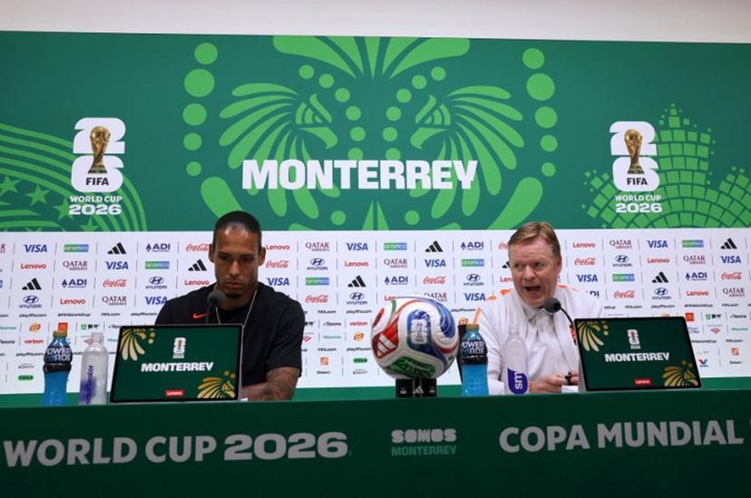 Netherlands' defender #04 Virgil van Dijk (L) listens as head coach Ronald Koeman speaks during a press conference on the eve of the 2026 World Cup Round of 32 football match between the Netherlands and Morocco at Monterrey stadium in Monterrey, Mexico on June 28, 2026.   Julio Cesar AGUILAR / AFP