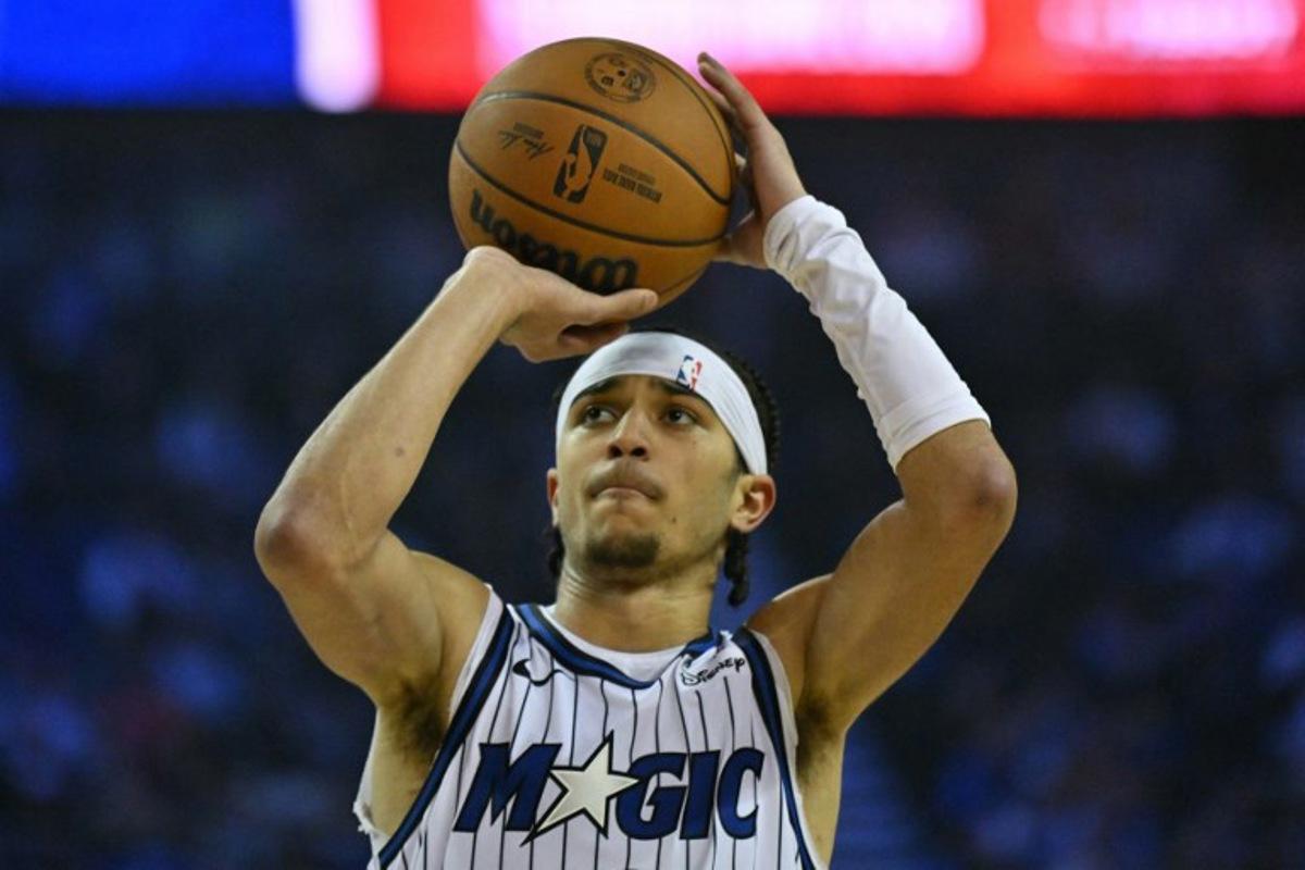 Orlando Magic's US point guard #00 Anthony Black takes a free throw during the 2025/2026 NBA season basketball match between the Memphis Grizzlies and Orlando Magic at the O2 Arena in London on January 18, 2026.  Glyn KIRK / AFP