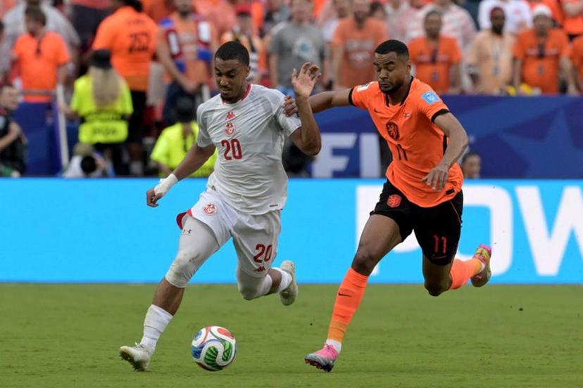 Tunisia's defender #20 Yan Valery and Netherlands' forward #11 Cody Gakpo fight for the ball during the 2026 World Cup Group F football match between Tunisia and the Netherlands at the Kansas City Stadium in Kansas City on June 25, 2026.   Juan MABROMATA / AFP