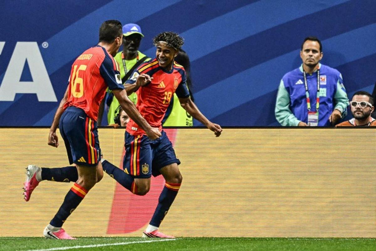 Spain's forward #19 Lamine Yamal (R) celebrates after scoring the opening goal during the 2026 World Cup Group H football match between Spain and Saudi Arabia at the Atlanta Stadium in Atlanta on June 21, 2026.   ROBERTO SCHMIDT / AFP
