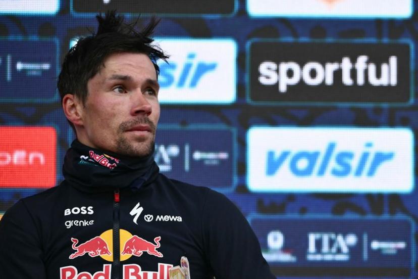 Slovenian Primoz Roglic, third, stands on the podium of the Milano-Torino 2026 cycling race, in Superga near Turin, on March 18, 2026. British Tom Pidcock (Pinarello-Q36.5 Pro Cycling Team) won the race ahead of Tobias Halland Johannessen (Uno X Mobility) and Primoz Roglic (Red Bull Bora hansgrohe). Marco BERTORELLO / AFP