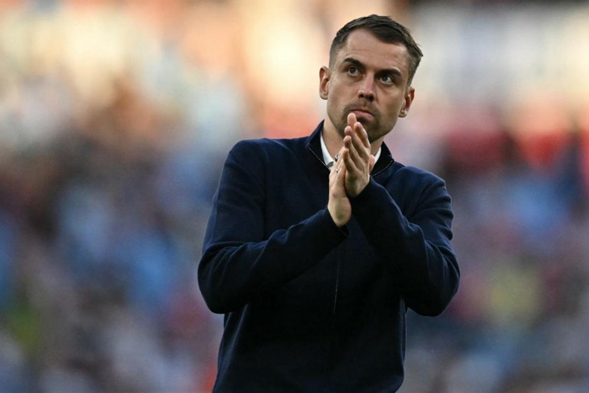 Southampton's German head coach Tonda Eckert applauds fans on the pitch after the English FA Cup semi final football match between Manchester City and Southampton at Wembley stadium in London, on April 25, 2026. City won the game 2-1 Ben STANSALL / AFP