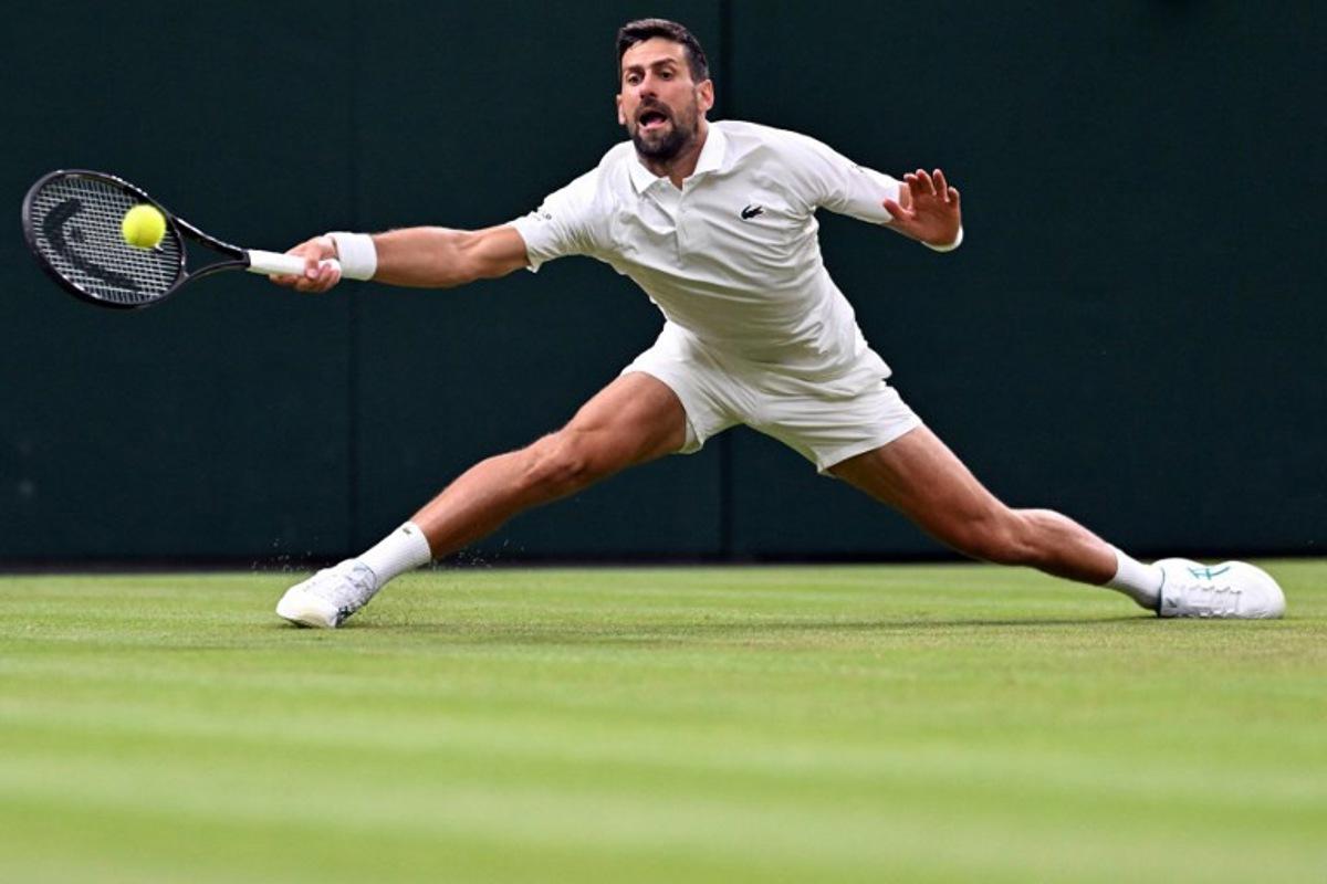 Serbia's Novak Djokovic returns the ball to Greece's Stefanos Tsitsipas during their men's singles second round tennis match on the third day of the 2026 Wimbledon Championships at The All England Lawn Tennis and Croquet Club in Wimbledon, southwest London, on July 1, 2026.  Kirill KUDRYAVTSEV / AFP