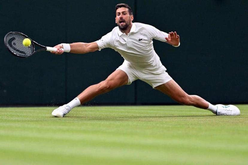 Serbia's Novak Djokovic returns the ball to Greece's Stefanos Tsitsipas during their men's singles second round tennis match on the third day of the 2026 Wimbledon Championships at The All England Lawn Tennis and Croquet Club in Wimbledon, southwest London, on July 1, 2026.  Kirill KUDRYAVTSEV / AFP