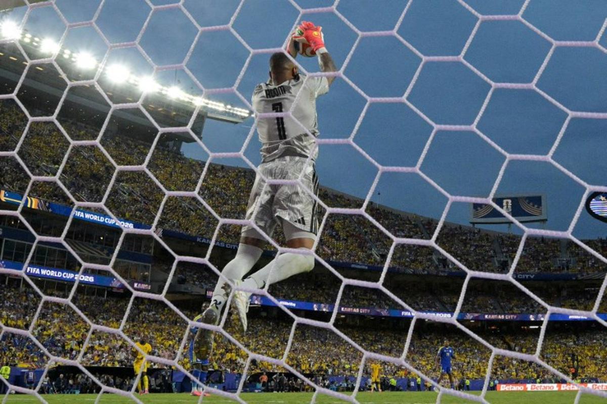 Curacao's goalkeeper #01 Eloy Room makes a save during the 2026 World Cup Group E football match between Ecuador and Curacao at the Kansas City Stadium in Kansas City on June 20, 2026.   JUAN MABROMATA / AFP