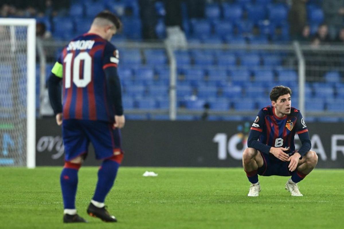 FC Basel's players react at the end of the UEFA Europa League - League phase, Matchday 8 - football match between FC Basel 1893 and FC Viktoria Plzen at St Jakob-Park stadium in Basel on January 29, 2026.   SEBASTIEN BOZON / AFP