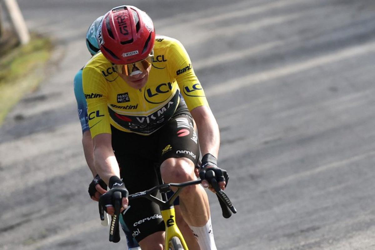 Team Visma - Lease a Bike's Danish rider Jonas Vingegaard, wearing the overall leader yellow jersey, rides in a breakaway with Bahrain - Victorious' French rider Lenny Martinez (hidden) during the 8th and final stage of the Paris-Nice cycling race, 129.2 km between Nice and Nice, on March 15, 2026.  Anne-Christine POUJOULAT / AFP
