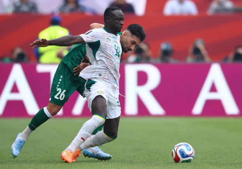 Senegal's forward #10 Sadio Mane and Iraq's defender #26 Frans Putros fight for the ball during the 2026 World Cup Group I football match between Senegal and Iraq at the Toronto Stadium in Toronto on June 26, 2026.   Cole Burston / AFP