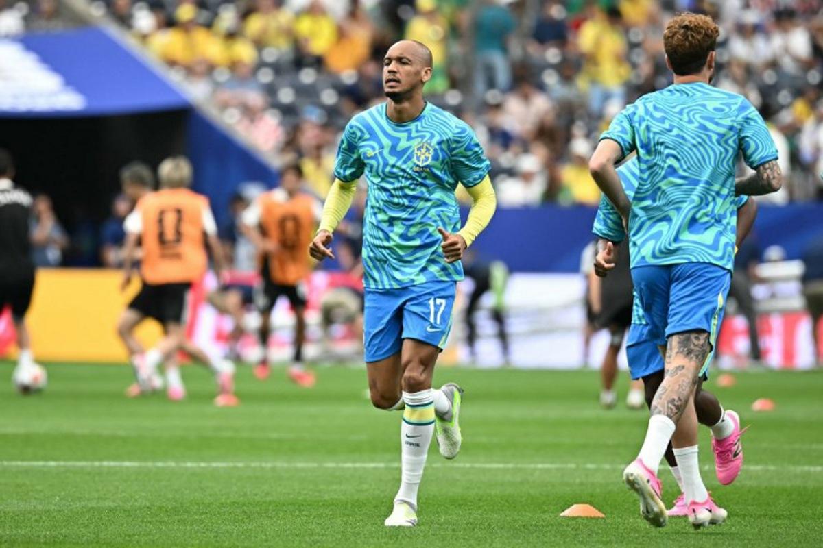 Brazil's midfielder #17 Fabinho warms up prior to the  2026 World Cup round of 32 football match between Brazil and Japan at the Houston Stadium in Houston on June 29, 2026.   Paul ELLIS / AFP