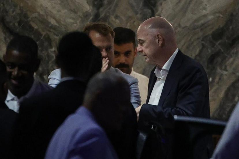 FIFA President Gianni Infantino (R) leaves Al-Madina Stadium in Rabat following the 2026 Women's Africa Cup of Nations match between Malawi and Zambia on August 5, 2026. Infantino, under fire for a now shelved plan to open the World Cup to private investment, earlier held emergency talks in Morocco with directors of the world football governing body. FIFA then issued an apology while reaffirming its "full support" for Infantino. In a statement, the leadership acknowledged "that errors were also made after the proposal was leaked to media". Abdelmajid BZIOUAT / AFP
