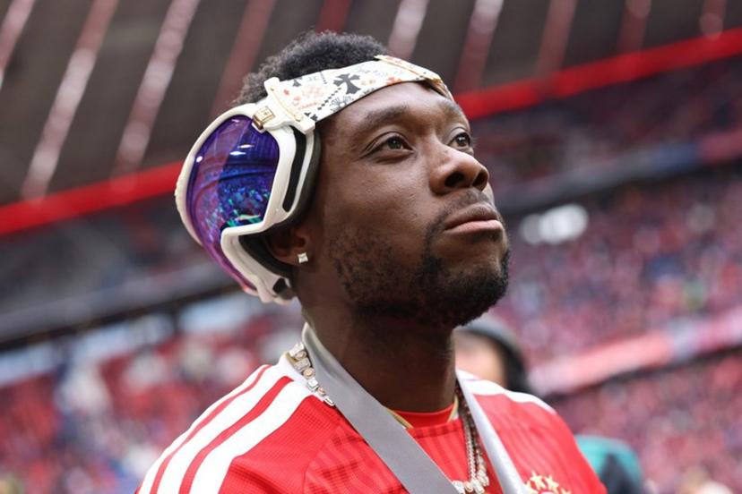 Bayern Munich's Canadian defender #19 Alphonso Davies looks on with sunglasses on the back of his head during celebrations for the Bundesliga trophy after the German first division Bundesliga football match between FC Bayern Munich and FC Cologne in Munich, southern Germany, on May 16, 2026.  Alexandra BEIER / AFP