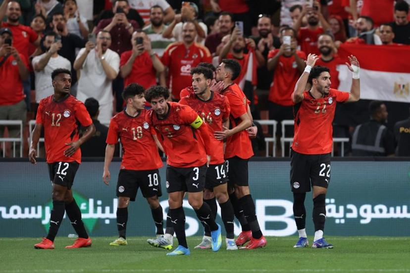 Egypt's forward #22 Omar Marmoush celebrates his goal with teammates during the friendly football match between Saudi Arabia and Egypt at King Abdullah Sports City in Jeddah on March 27, 2026.  AFP