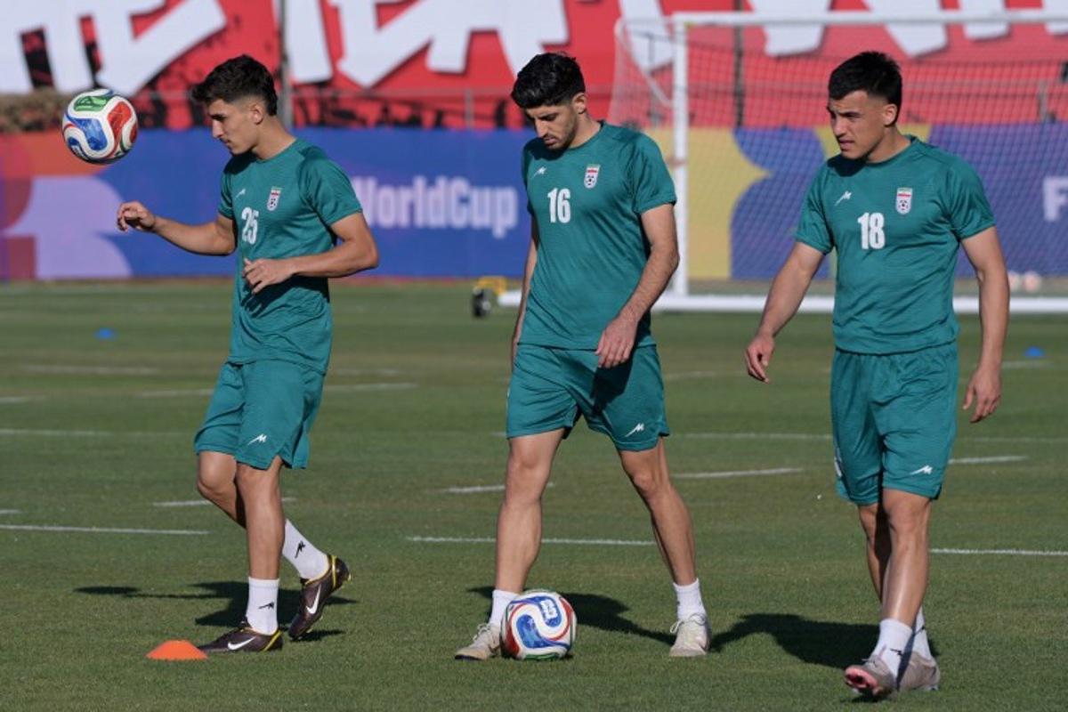Iran's defender #25 Danial Iri, midfielder #16 Mehdi Torabi, and forward #18 Amirhossein Hosseinzadeh take part in a training session during the 2026 World Cup football tournament at the Centro Xoloitzcuintle in Tijuana, Mexico on June 12, 2026.  Guillermo Arias / AFP