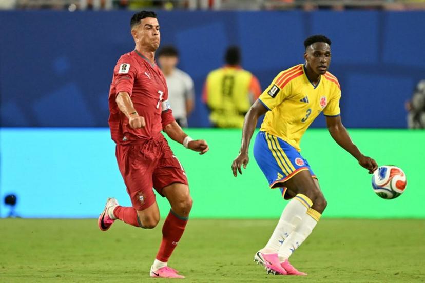 Portugal's forward #07 Cristiano Ronaldo and Colombia's defender #03 Jhon Lucumi fight for the ball during the 2026 World Cup Group K football match between Colombia and Portugal at the Miami Stadium in Miami Gardens on June 27, 2026.   CHANDAN KHANNA / AFP