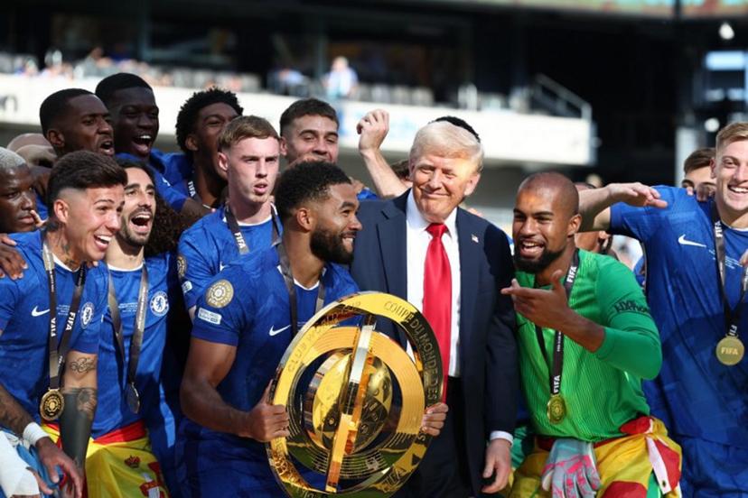 Chelsea's Reece James holds the trophy as he celebrates with teammates and US President Donald Trump after Chelsea won against Paris St Germain in the FIFA Club World Cup final, at the MetLife Stadium in East Rutherford, New Jersey on July 13, 2025.  Kevin Lamarque / POOL / AFP